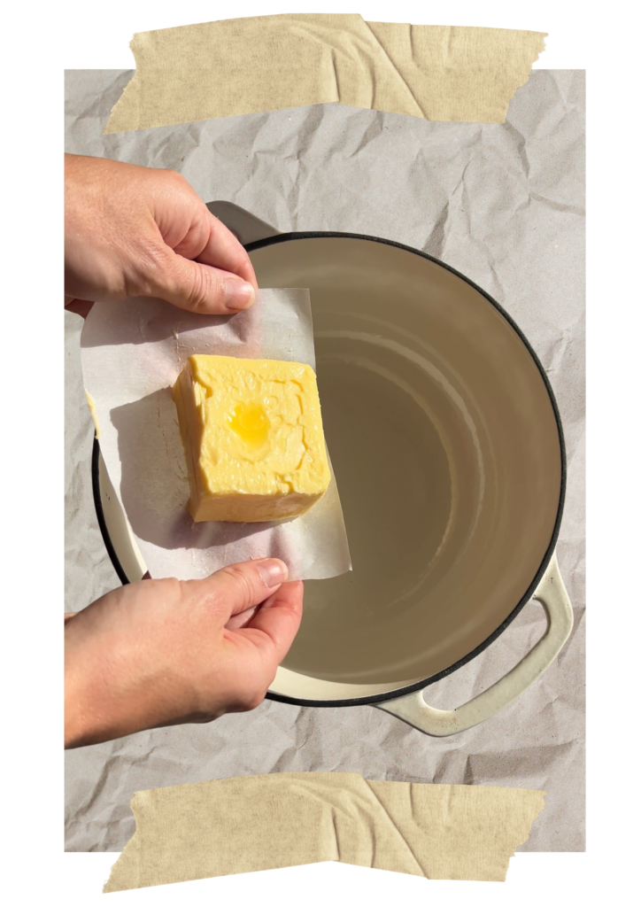 Hands holding block of butter