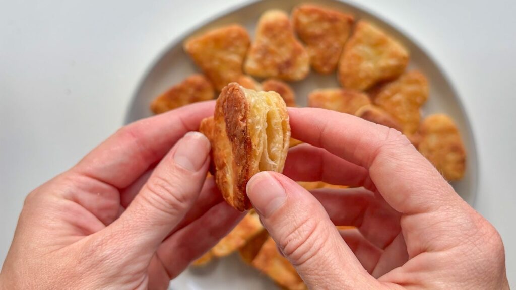 Hand holding puff pastry