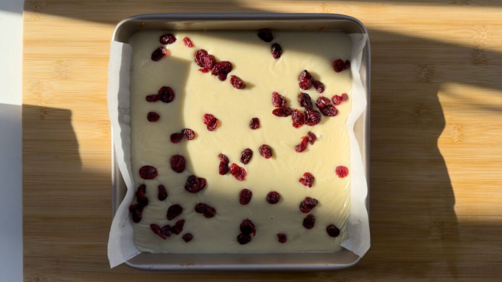 Cranberry white chocolate blondies in pan