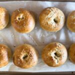 Bagels on baking sheet